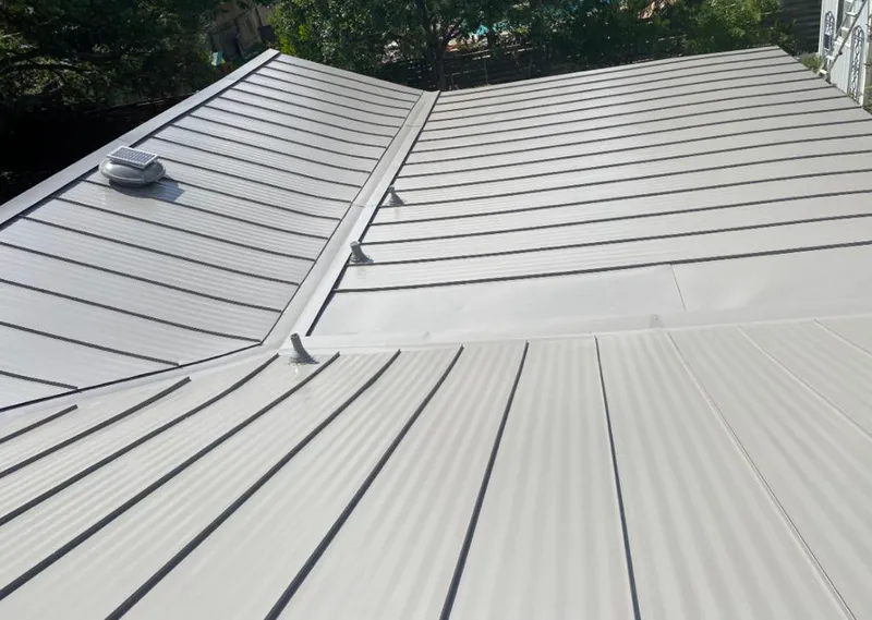 Solar attic fan installed on a metal roof for Roof Ventilation in Bethesda